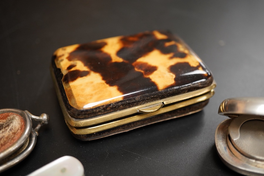 An Edwardian silver sovereign/half sovereign case, William Neale & Sons, Chester, 1906, 61mm, together with a mother of pearl handled silver fruit knife, a tortoiseshell purse and a shell mounted pen knife.